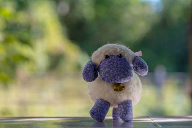 Sheep doll on blurr background with Morning sun