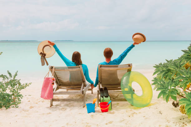istock happy couple relax on a tropical beach 898354680