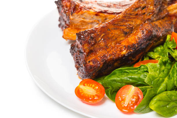 ribs grilled with salad on a white background