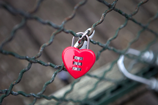 Heartshaped padlock. metal love padlocks with heart decoration. Traditional heart-shaped lock as a symbol of eternal love.