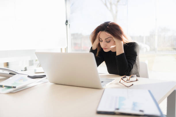 istock Stressed businesswoman in the office 898357620