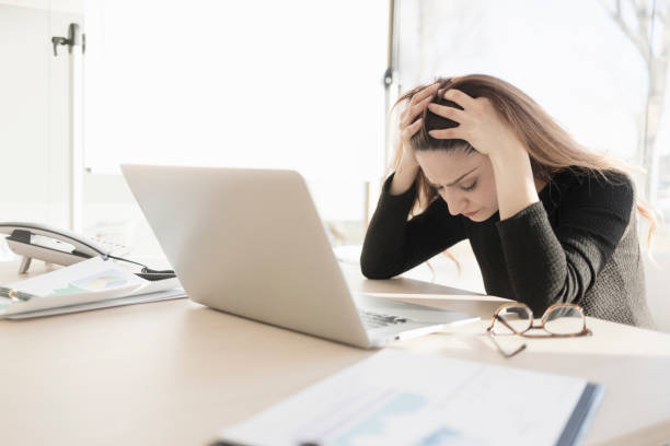 istock Stressed woman working in the office 898357624