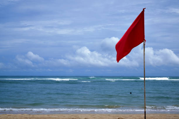 istock A red warning flag on the beach in the Nuca Dua Bali 898360578