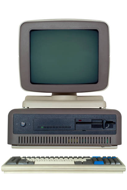 istock old computer (late 80's) with a horizontal system unit, and a CRT monitor isolated 898363246