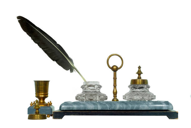 istock ancient inkstand with a bird feather sticking from the inkwell, isolated 898363266