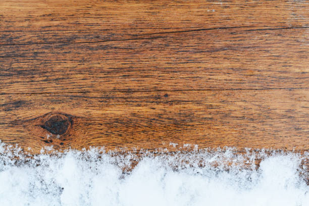 istock Aged wood texture with snow border, copy space 898364120