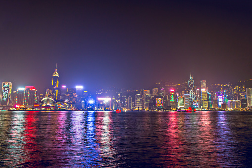 Hong Kong - December 9, 2017. New year and Christmas skyline shines landmark at Victoria harbour night scene with fog in Hong Kong winter festival. Hong Kong  has one of the world's most festive Christmases and New year count down