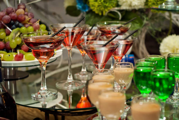 istock Glass glasses with colored drinks on the table 898369778