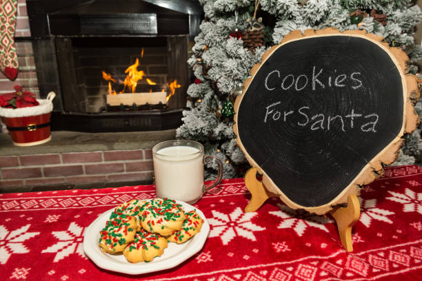 las galletas y la leche de santa - flocked fotografías e imágenes de stock