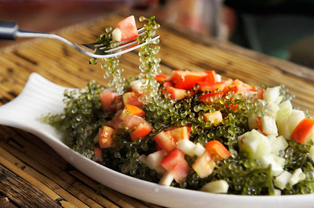 Healthy Japanese salad with green "caviar" laminaria. stock photo