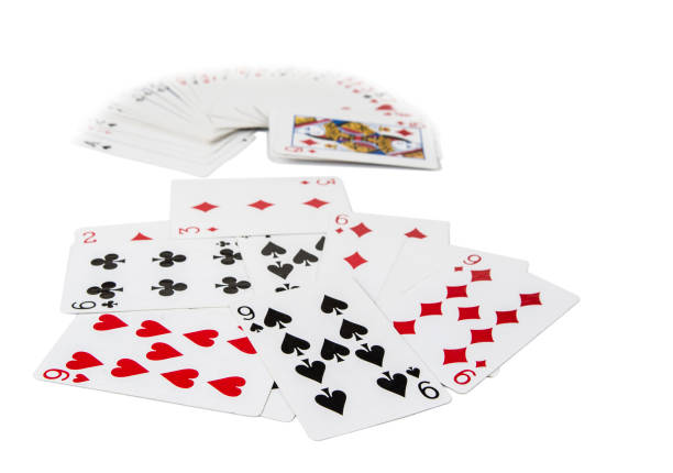 istock Playing cards spreaded on the white background 898371128