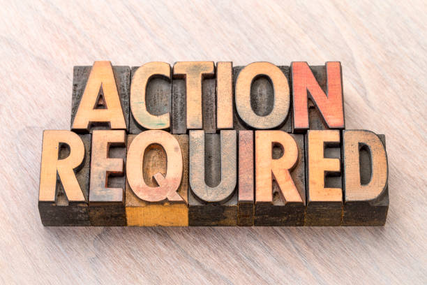 istock Action required - banner in wood type 898371816