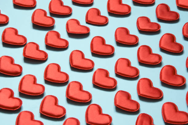 istock Pattern made of red hearts on blue. Heart in isometric style. Valentine's card. 898371884