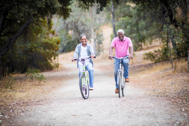 istock Senior African American Couple Riding Bikes 898373324