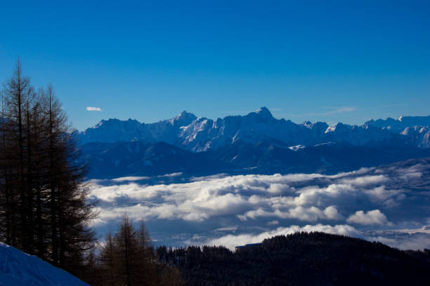 istock Sunny and snowy mountain landscape 898375496