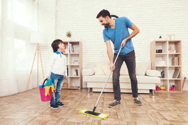 Photo of Father has fun with his son. An exemplary father and a boy at leisure.