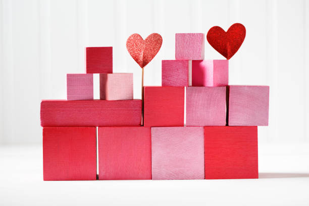 istock Red and pink wooden blocks with small hearts 898380670