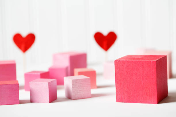 istock Red and pink wooden blocks with small hearts 898380692