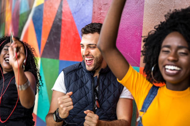 istock Friends dancing in the park 898384276