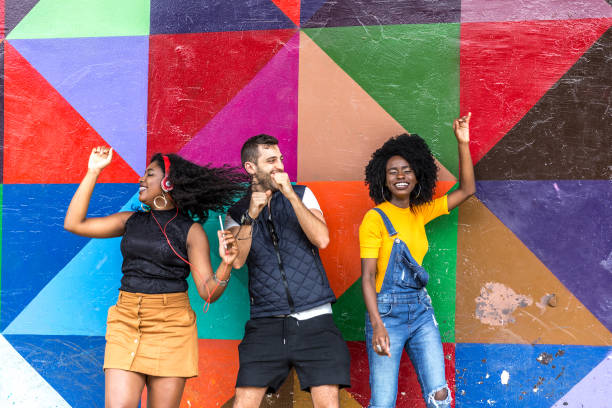 istock Friends dancing in the park 898384280