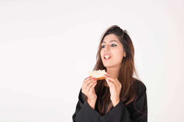 istock Beautiful Arab woman eating sandwich 898386368