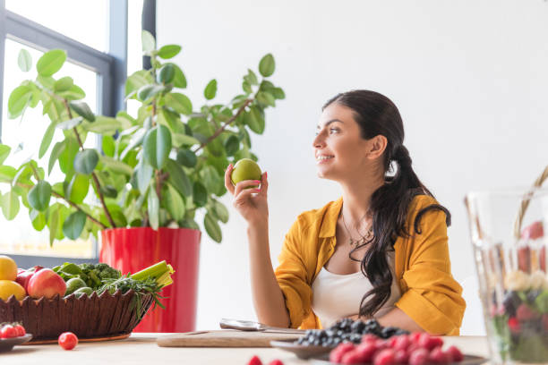 istock woman with fresh apple 898389858