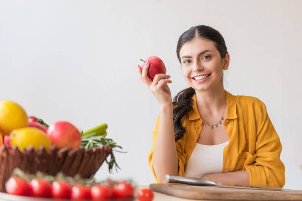 istock woman with fresh apple 898390050