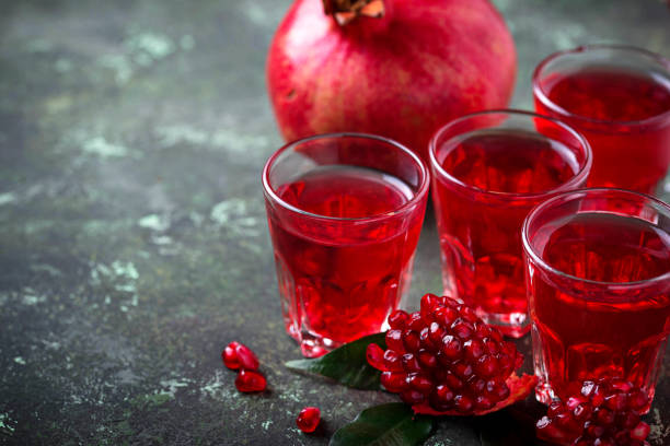 istock Glasses of fresh pomegranate juice. 898391192