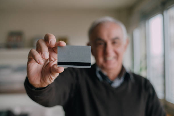 istock A credit card held by a senior man 898394554