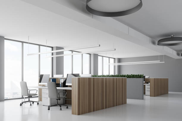 istock White office corner, wooden desks concrete 898395332