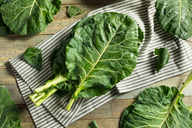 Raw Green Organic Collard Greens Raw Green Organic Collard Greens Ready to Cook kale stock pictures, royalty-free photos & images