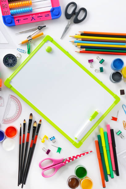 istock School supplies with a small flipchart on white. 898405692