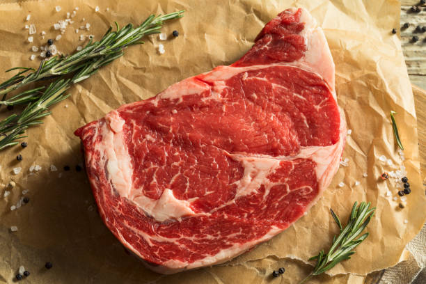 Raw Grass Fed Boneless Ribeye Steak Raw Grass Fed Boneless Ribeye Steak Ready to Cook rib eye steak stock pictures, royalty-free photos & images