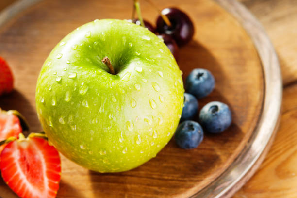 Photography of a fresh fruits on a wooden cutting board