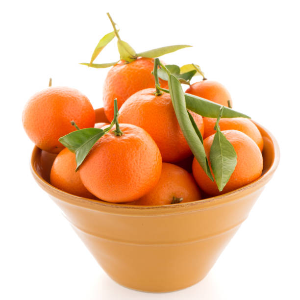 istock Tangerines on ceramic yellow bowl 898423046