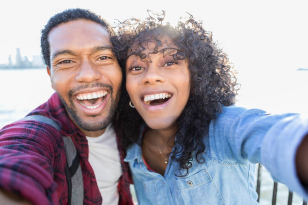 istock Young couple takes selfie on vacation 898424634