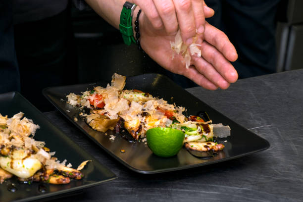 istock Delicious dish of grilled octopus over fresh vegetables 898425950