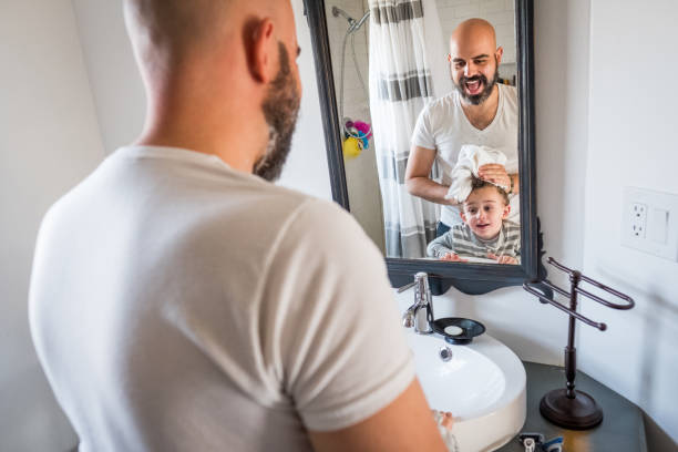 istock Father dries son's hair 898426208