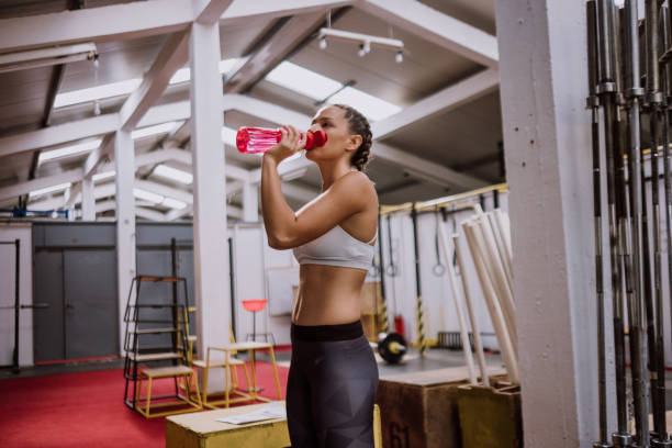 istock Sportswoman Drinking Water 898429018