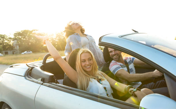 istock Friends traveling with car 898430050