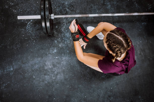 Girls Fighters Girl Lifting Weights In Gym strap photos stock pictures, royalty-free photos & images