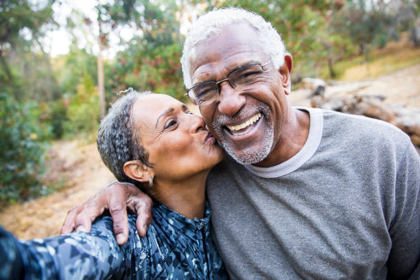 Senior Black Couple Taking Selfie During Exercise A beautiful senior African American Couple takes a selfie during their workout white hair photos stock pictures, royalty-free photos & images