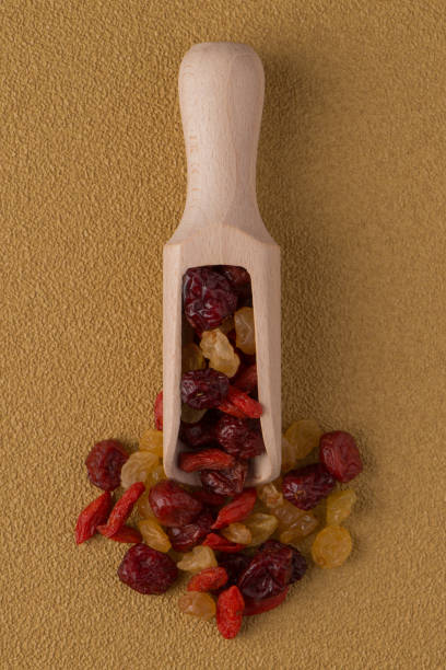 istock Wooden scoop with mixed dried fruits 898435288