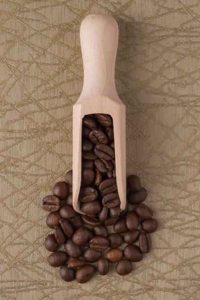 istock Wooden scoop with coffee beans 898436140
