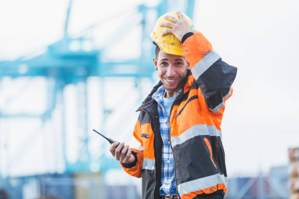 istock Hispanic man working at shipping port 898438424