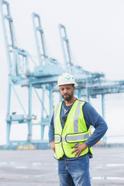 istock Dock worker at shipping port 898438492