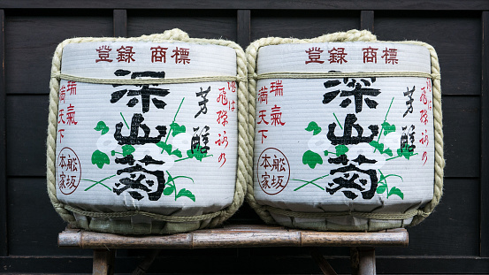 Takayama, Japan - February 16, 2017 - Two kazaridaru, or decorative sake barrels, in front of a sake brewery.