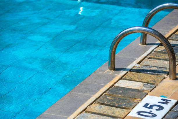 istock Children's swimming pool with sunny reflections 898450792