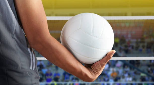Volleyball player with ball on volleyball court Volleyball player with ball on volleyball court strike protest action photos stock pictures, royalty-free photos & images
