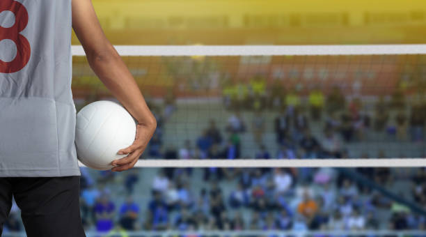 Volleyball player with ball on volleyball court Volleyball player with ball on volleyball court strike protest action stock pictures, royalty-free photos & images